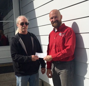 home inspector sw calgary presenting a cheque to client